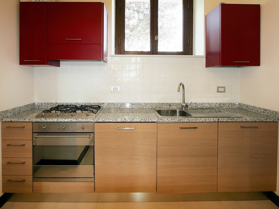 Countertop, Room, Cabinetry, Kitchen, Property, Furniture, Sink, Tile, Kitchen Sink, Floor