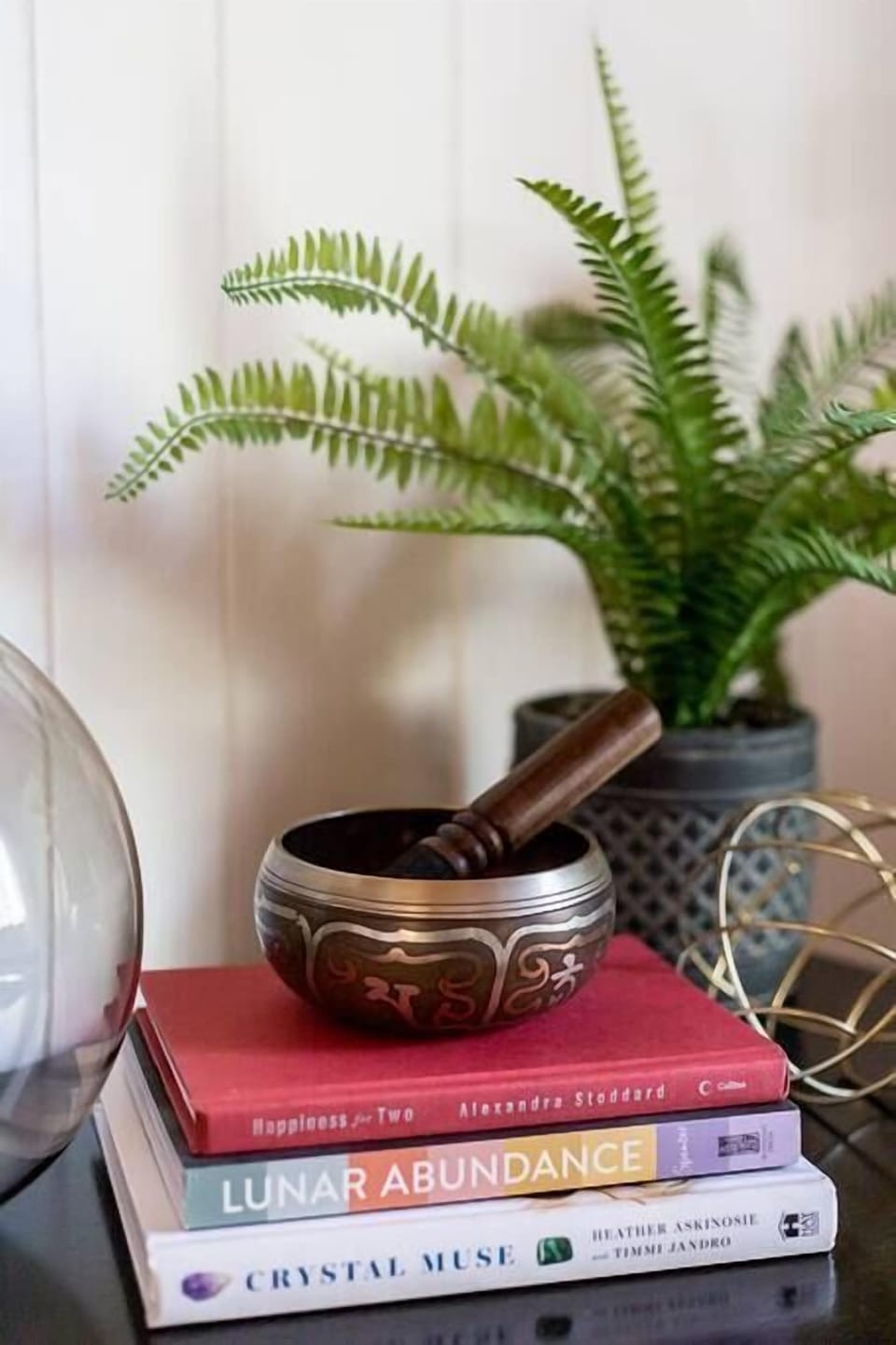 A touch of spirituality with a Tibetan singing bowl and lots of fun books.