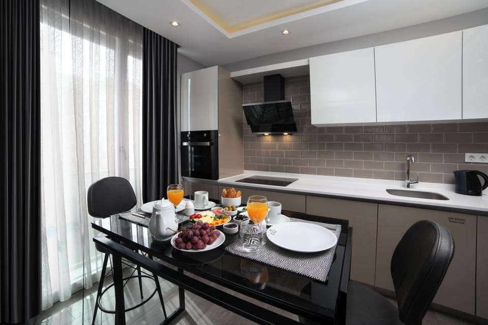 Family Condo | Private kitchenette | Full-size fridge, microwave, oven, stovetop