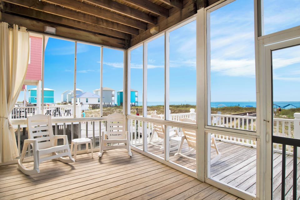 Screened in porch with views of the Beach