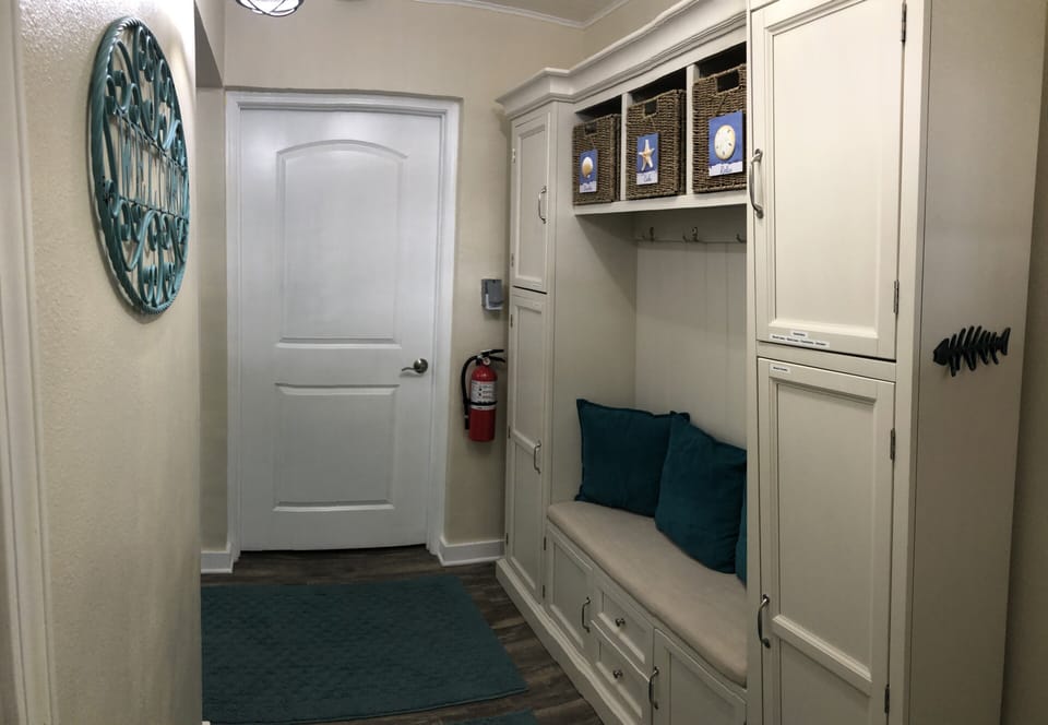 Storage cabinet with beach towels and bags and room to store your extra items