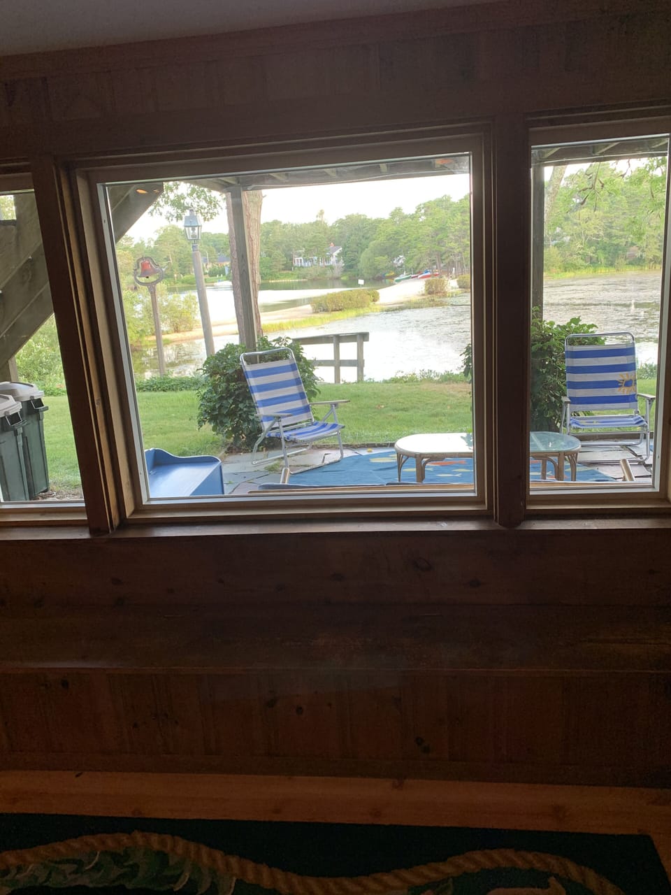 Picture window overlooking garden and pond. board games under window seat.