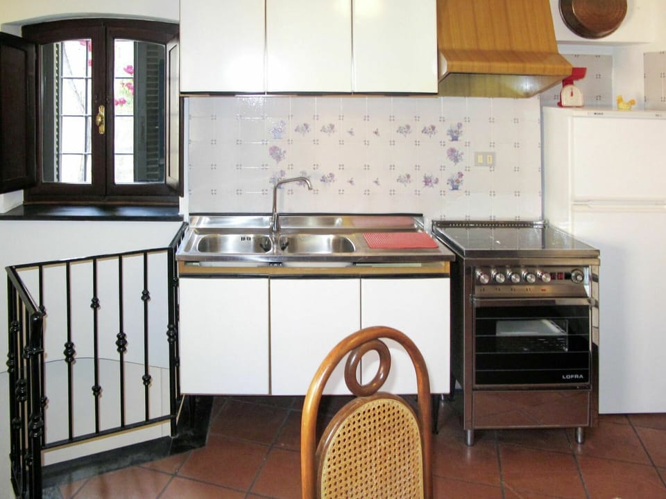 Kitchen, Room, Countertop, Furniture, Cabinetry, Property, Kitchen Stove, Major Appliance, Home Appliance, Interior Design