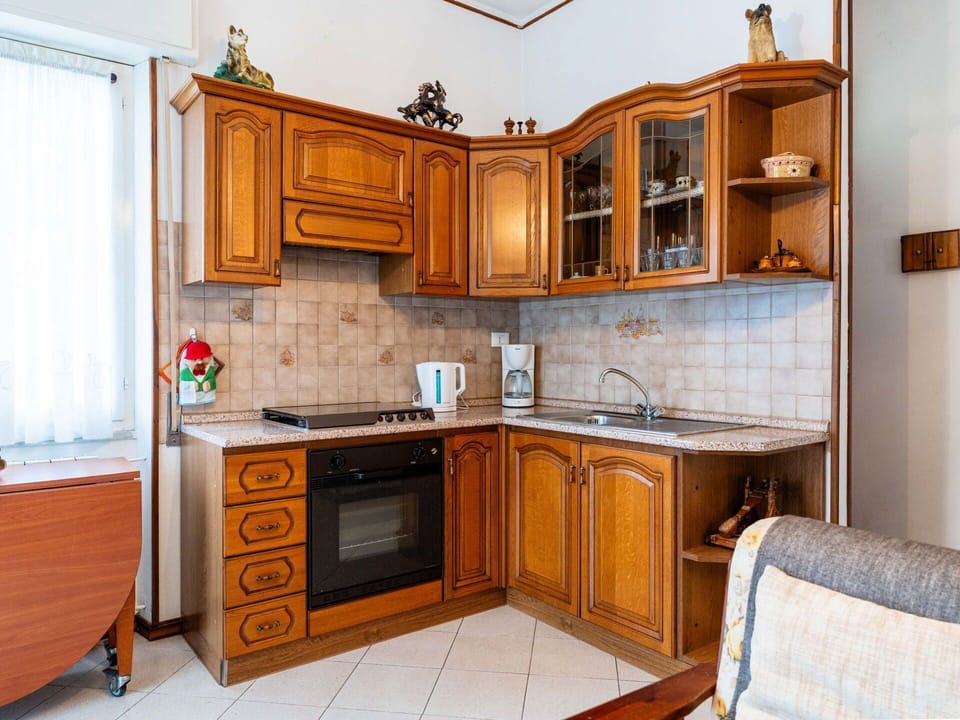 Furniture, Cabinetry, Kitchen, Interior Design, Countertop, Wood, Flooring, Kitchen Appliance, Major Appliance, Floor