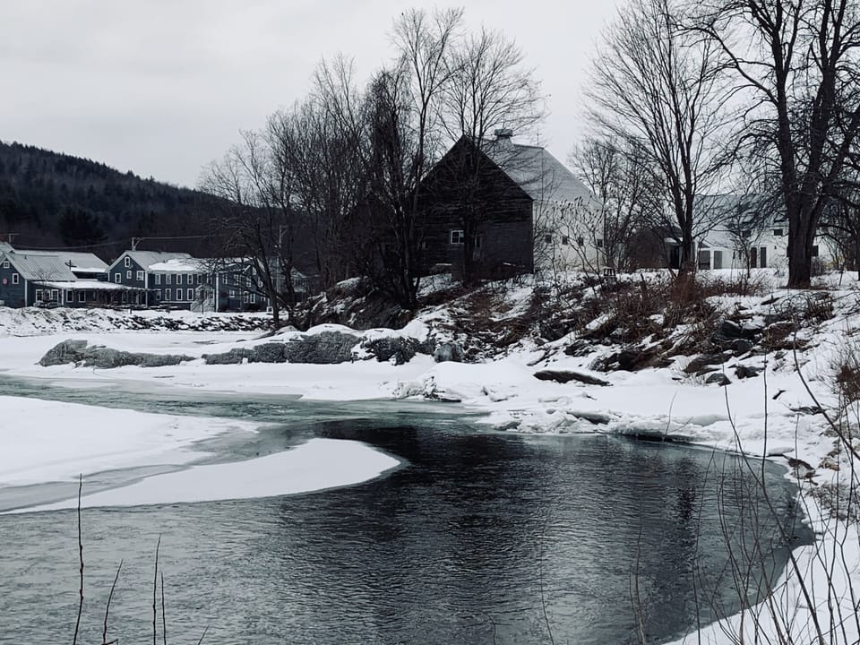 View of barn and house on right. Town on Left.