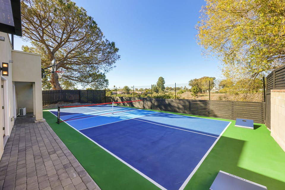 Full-size pickleball court and a versatile basketball hoop.