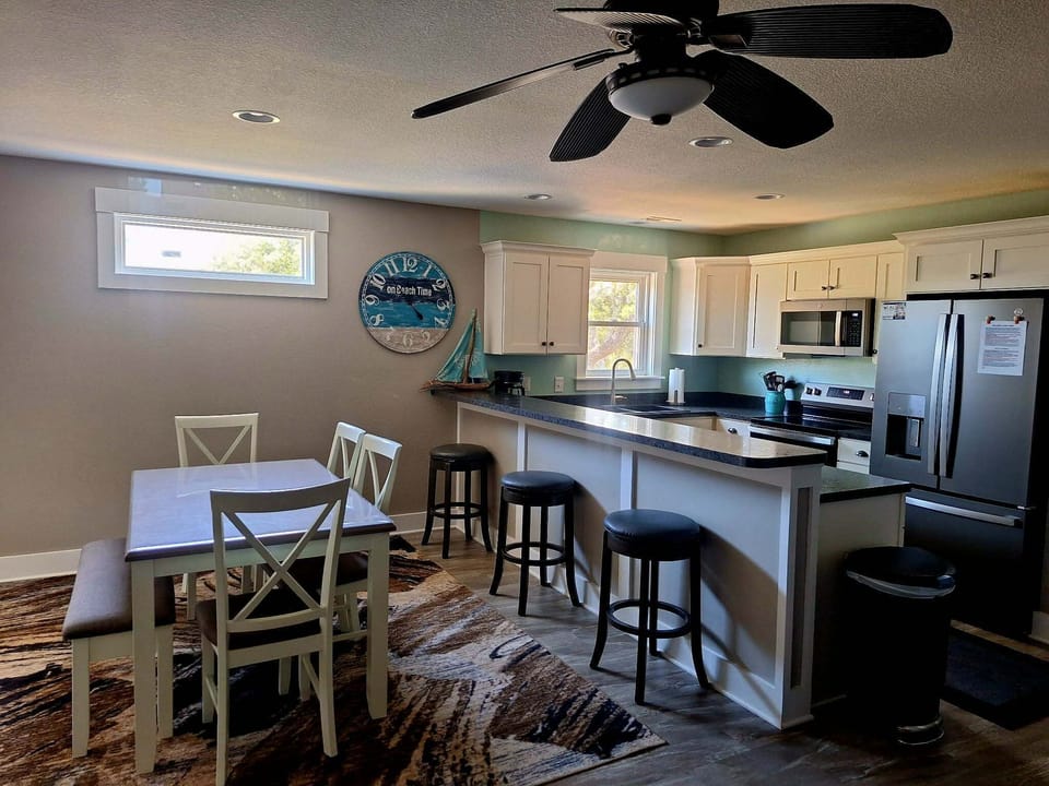Open kitchen/dining area with all new appliances for 2026.