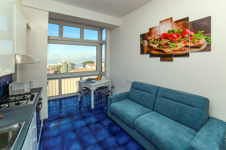 Family Apartment, 2 Bedrooms, Sea View | Living area | 21-inch flat-screen TV with digital channels, TV