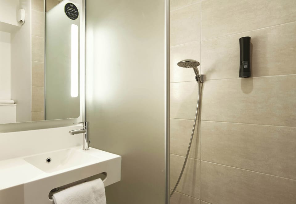 Shower, towels, soap, toilet paper