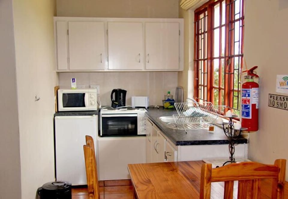 Olive Cottage | Private kitchenette | Coffee/tea maker, electric kettle, highchair