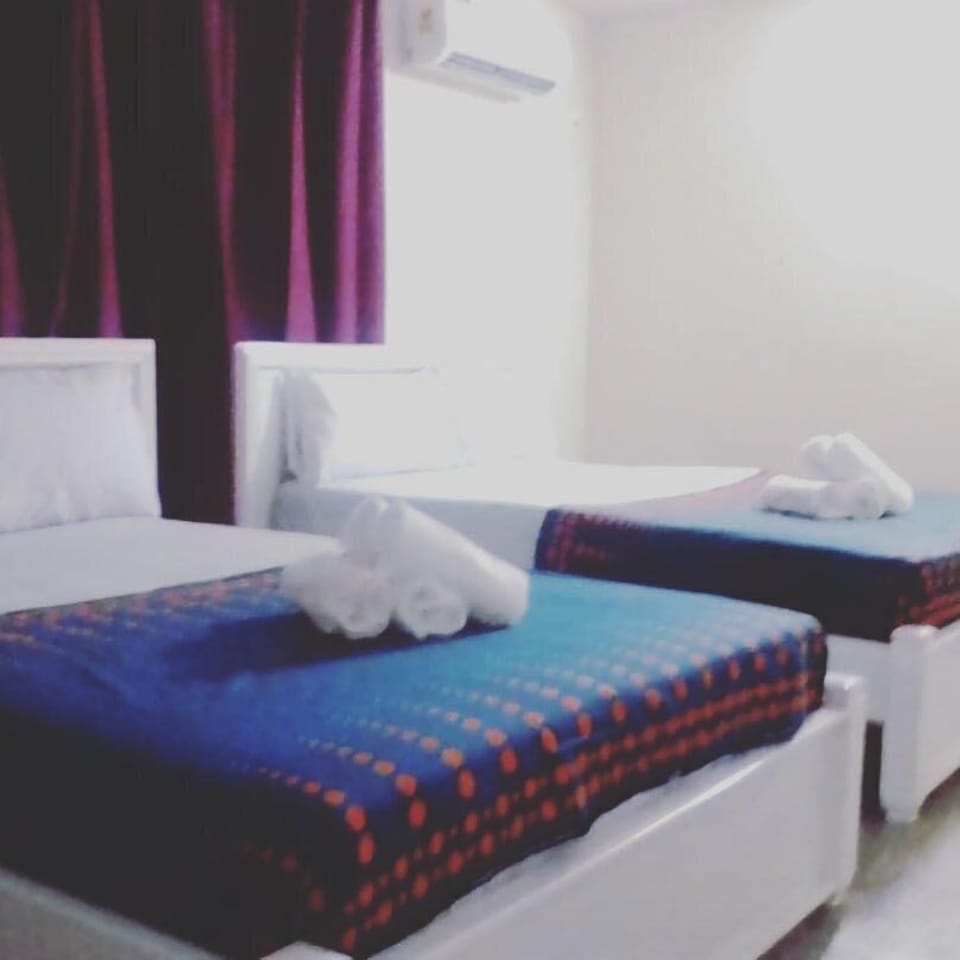 Standard Quadruple Room, 2 Double Beds, Shared Bathroom | Iron/ironing board, WiFi (free)