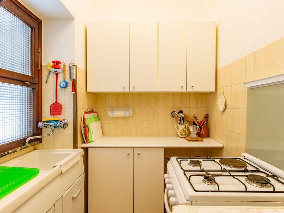 Cabinetry, Countertop, Kitchen Sink, Gas Stove, Kitchen, Window, Kitchen Appliance, Cooktop, Kitchen Stove, Window Blind