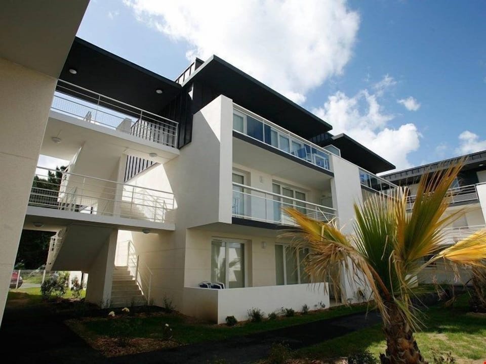 Walk to your accommodations through lush, tropical gardens.