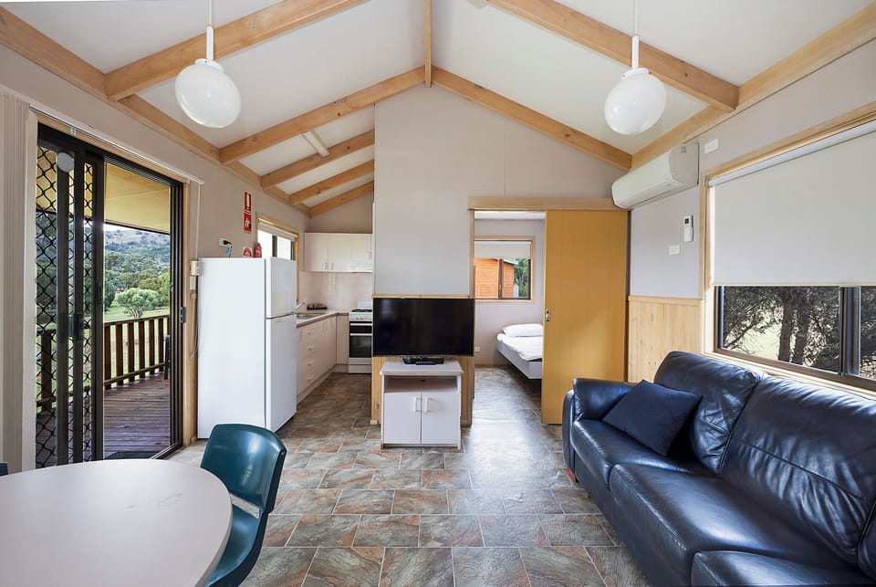 Standard Cabin 5pax - Bayande Bay | Living area | 55-inch flat-screen TV with satellite channels, TV, Netflix