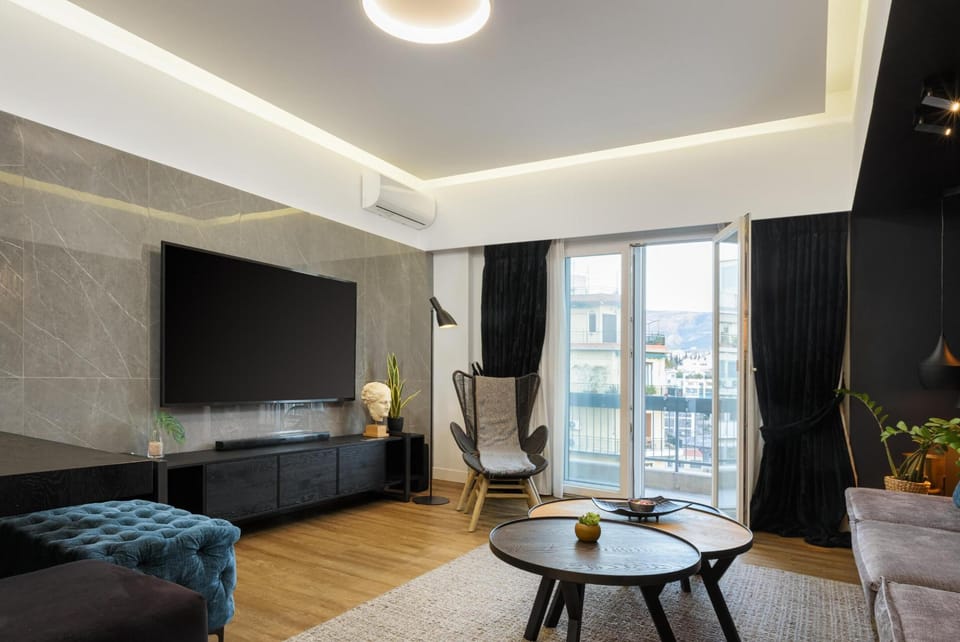 Exclusive Apartment, 4 Bedrooms | Living area | 70-inch flat-screen TV with cable channels, Smart TV, Netflix