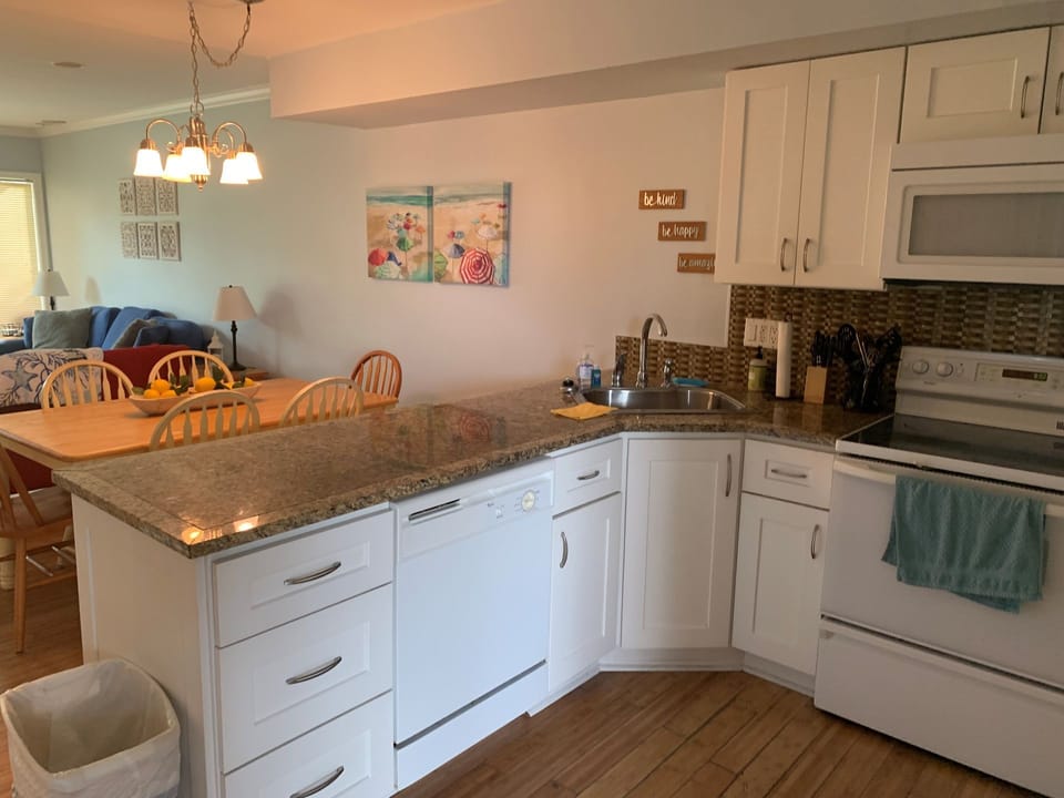 Open Concept Kitchen with View to Dining and Living Room