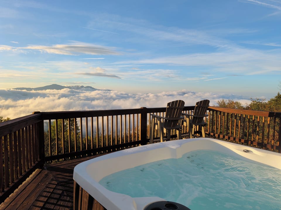 Your front-row seat to the clouds and ridgelines. Relax in the hot tub and watch the sky change—this is the photo people book for.