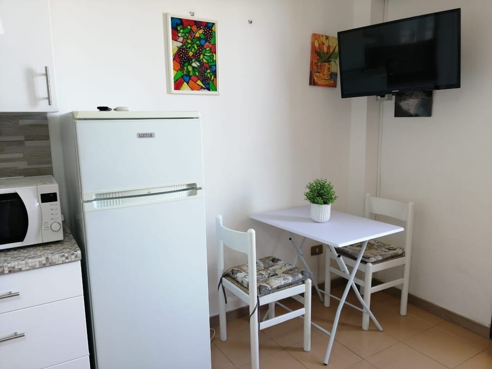 Apartment, 1 Bedroom | Living room | Flat-screen TV