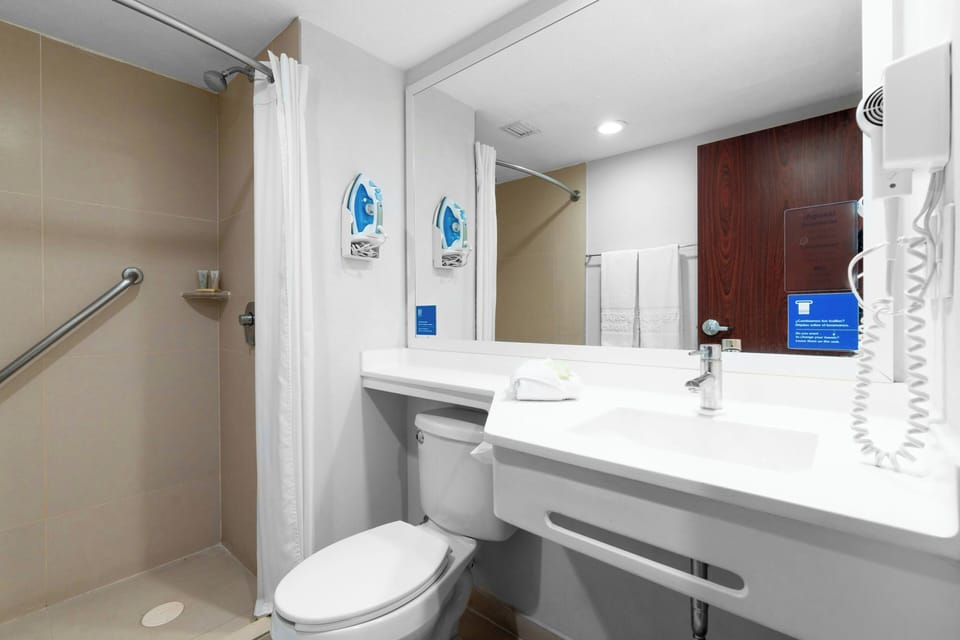 Room, 2 Double Beds | Bathroom | Shower, rainfall showerhead, hair dryer, towels