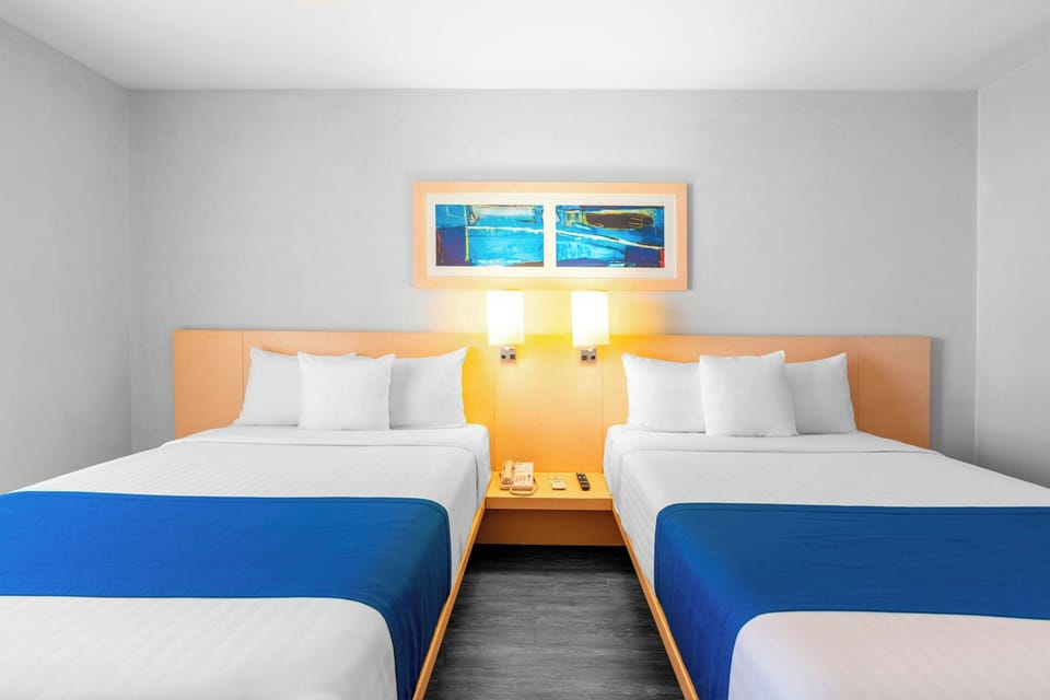 Room, 2 Double Beds | In-room safe, desk, iron/ironing board, free WiFi