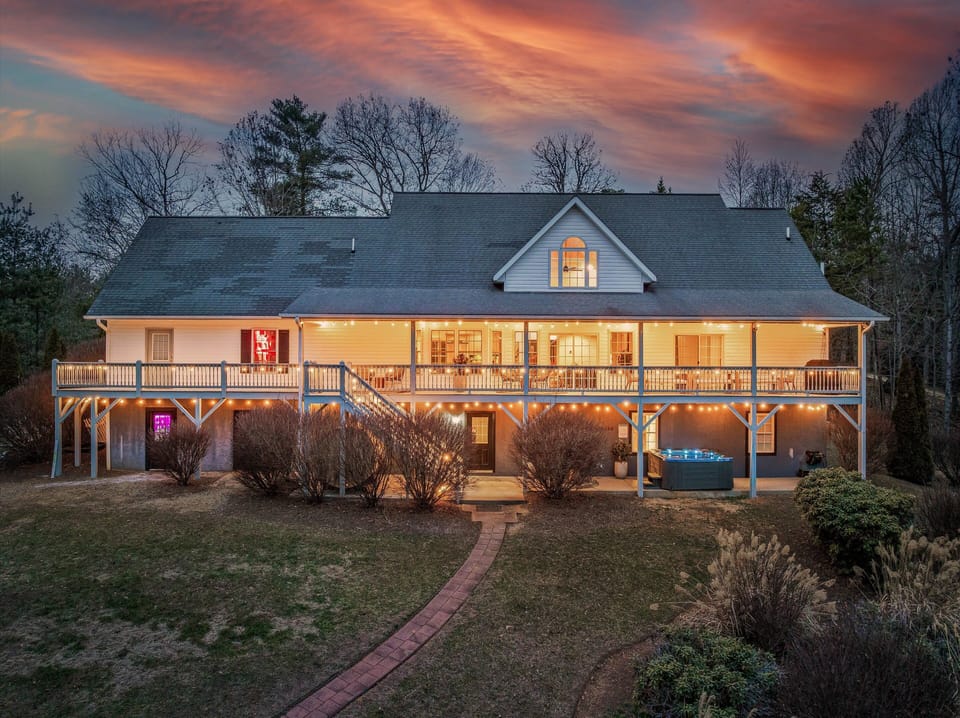 [Exterior] Warm String Lights and Outdoor Lighting Create a Magical Glow During the Night.