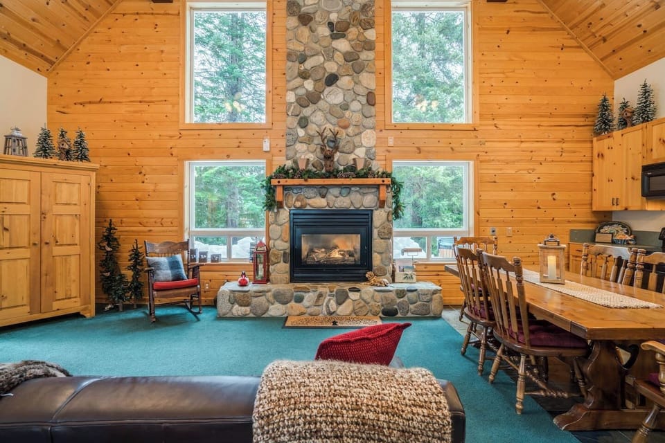 Do you love our River Rock fireplace and floor to ceiling windows with river views as much as we do?!