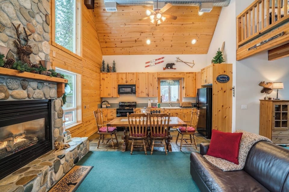 Enjoy our beautiful floor to ceiling River Rock fireplace right from the dining table.