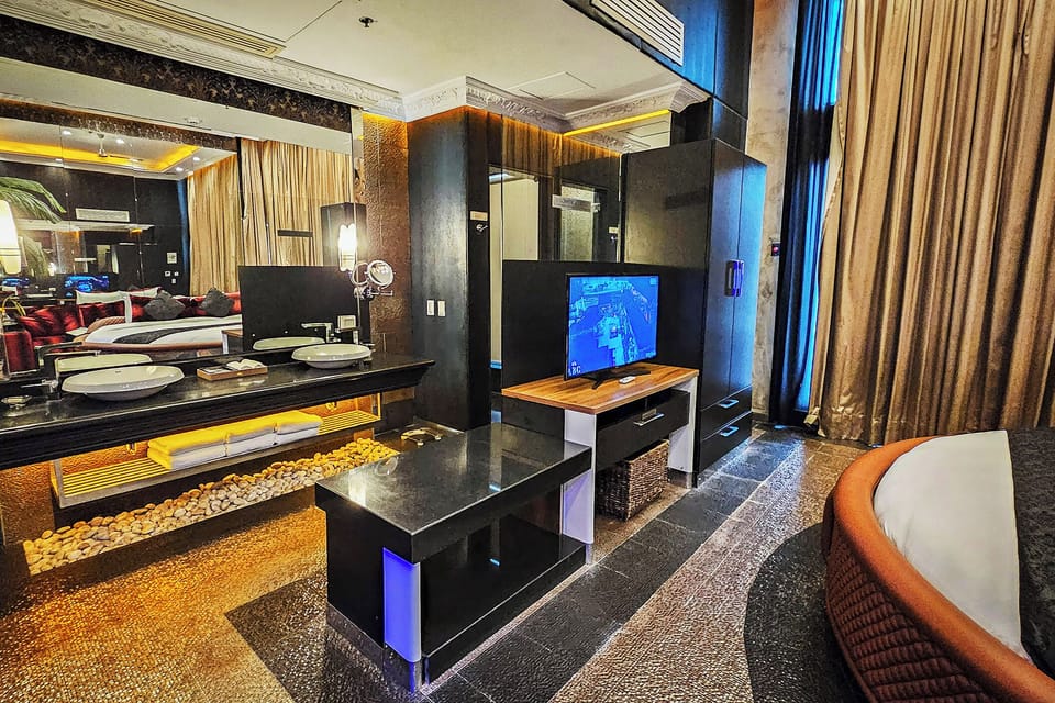 New Millennium Penthouse 2-Bedroom Suite, 2 Big Round Beds | Bathroom | Separate tub and shower, free toiletries, hair dryer, bathrobes