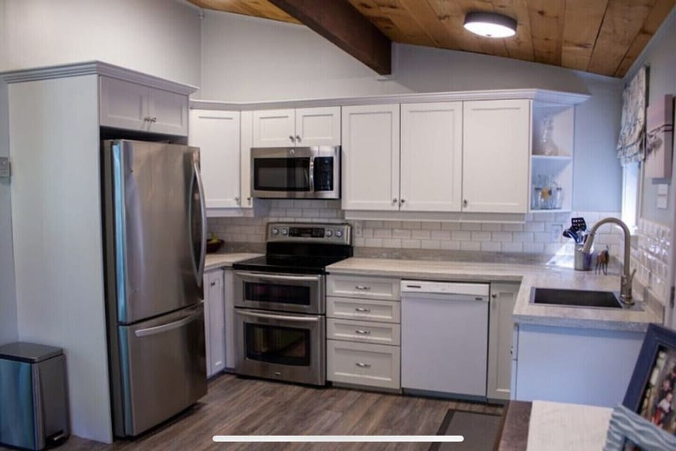 New kitchen with stainless steel appliances.