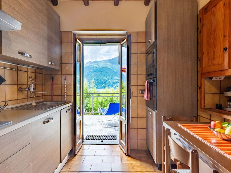 Property, Cabinetry, Countertop, Building, Wood, Plant, Kitchen, Interior Design, Architecture, Flooring