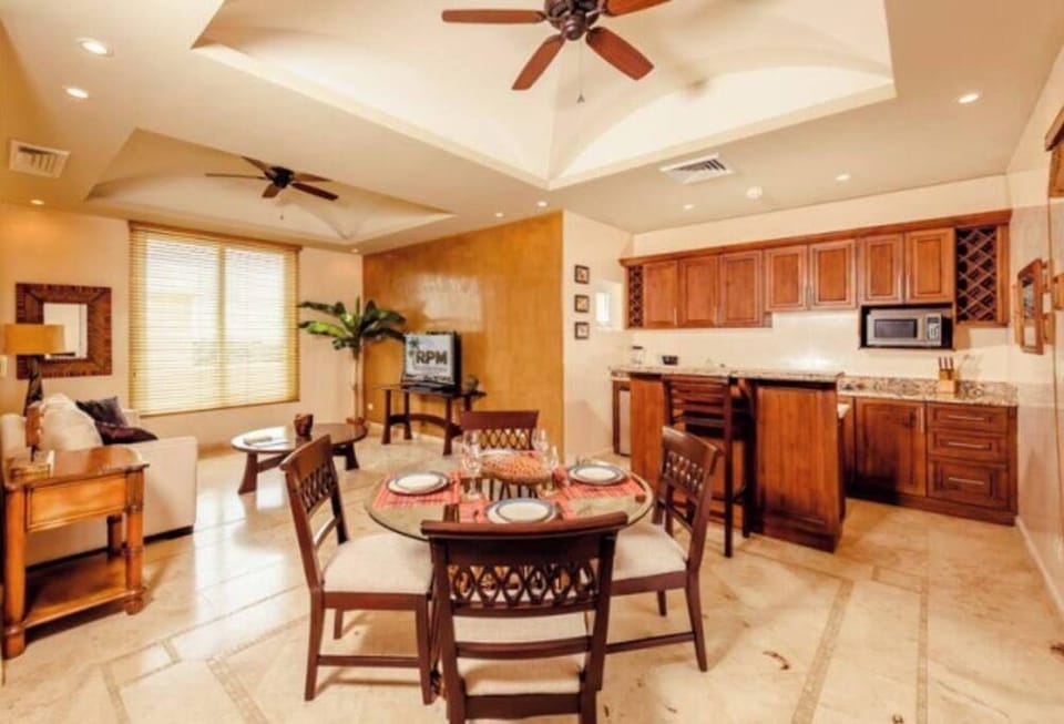 This studio style penthouse has a second kitchen, living area, and dining table. 