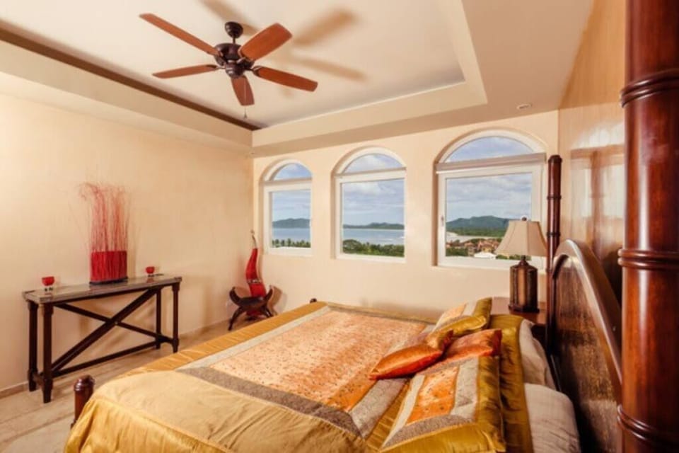 This bedroom is furnished with a king bed and has breathtaking ocean views. 