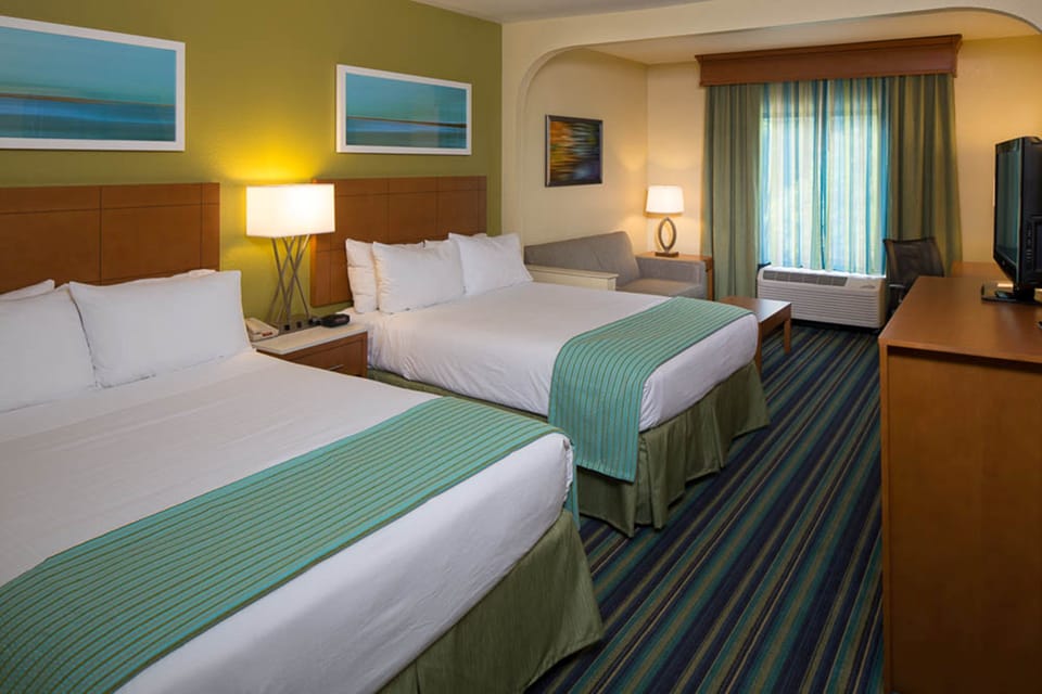Suite, 2 Queen Beds | Desk, laptop workspace, blackout drapes, iron/ironing board