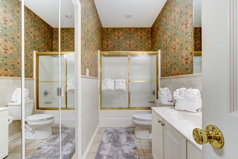 Guest bath has a full size washer and dryer