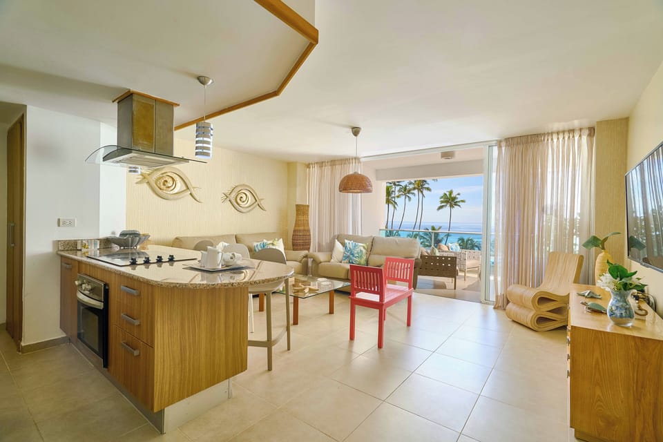 Beachfront Living Room – Relax with A/C, Smart TV, and ocean views — your cozy corner by the beach.