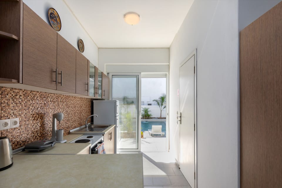 Superior Room, Private Pool, Pool View | Private kitchen | Fridge, stovetop, coffee/tea maker, electric kettle
