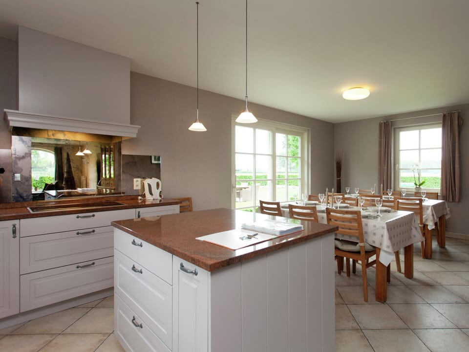 Villa | Private kitchen | Fridge, microwave, oven, highchair