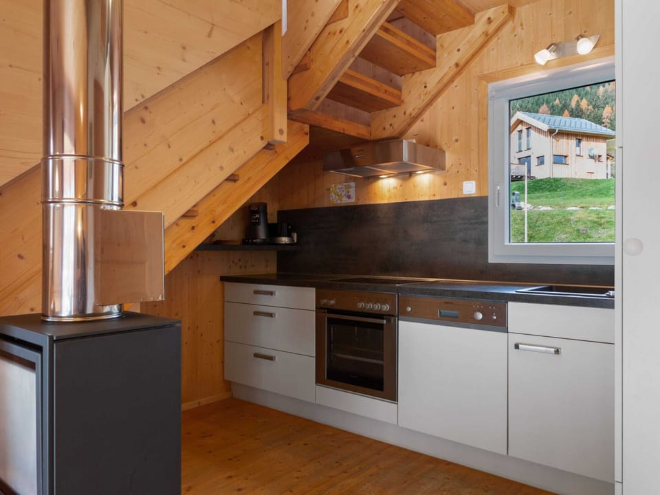 Chalet | Private kitchen | Stovetop, electric kettle, cookware/dishes/utensils, dining tables