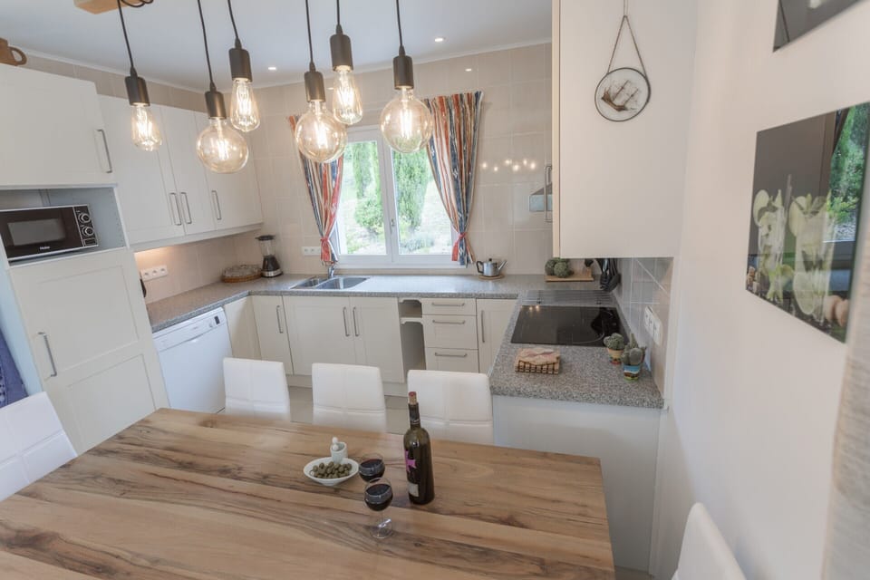 Villa | Private kitchen | Fridge, microwave, highchair