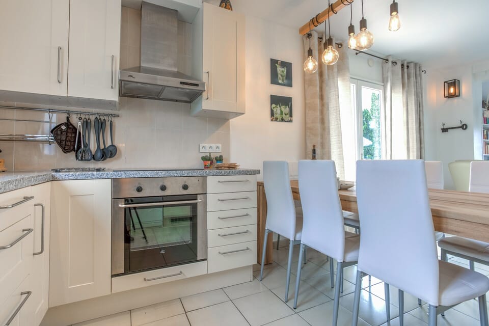 Villa | Private kitchen | Fridge, microwave, highchair