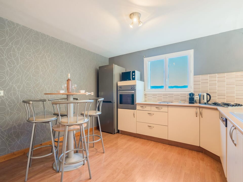 Villa | Private kitchen | Fridge, oven, highchair