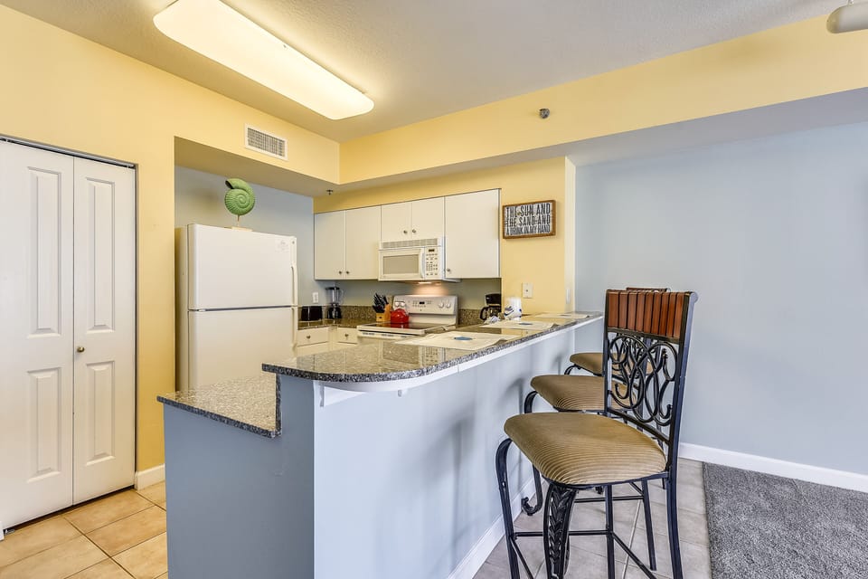 Fully Stocked Kitchen with Bar Seating