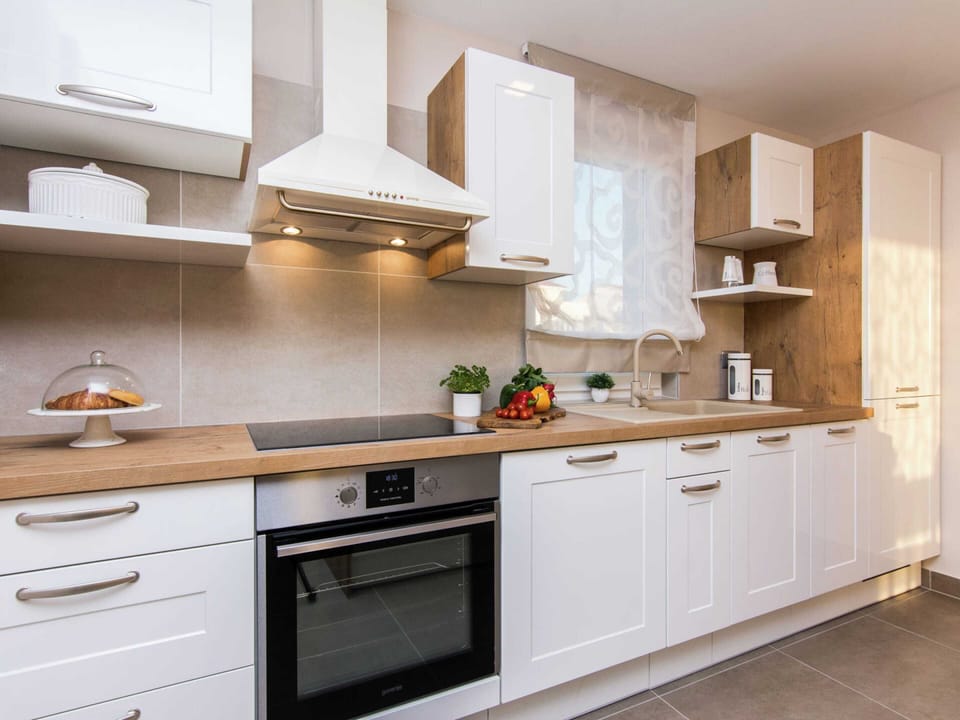Villa | Private kitchen | Microwave, highchair