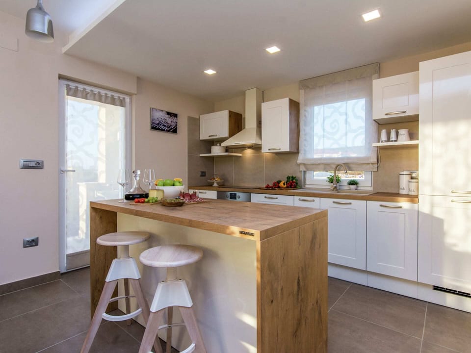 Villa | Private kitchen | Microwave, highchair