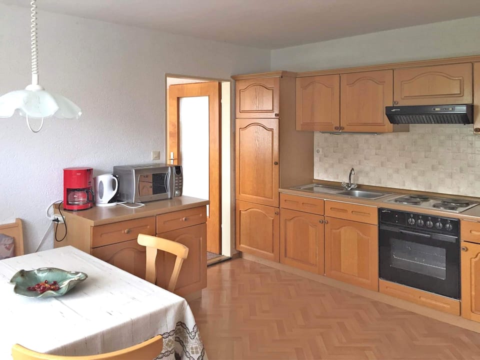Apartment | Private kitchen | Stovetop, electric kettle, toaster, highchair