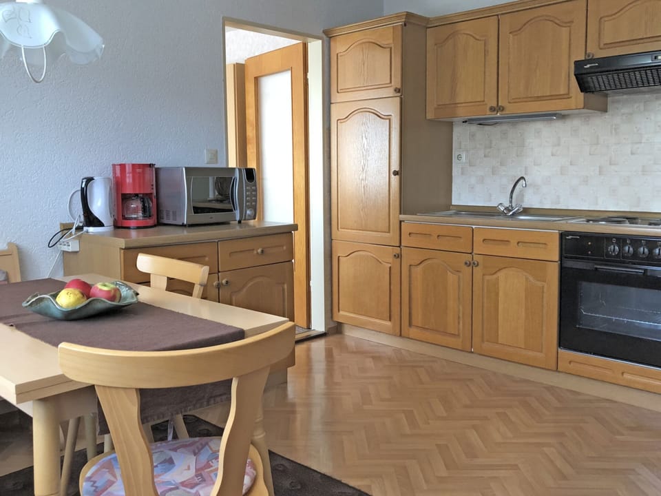 Apartment | Private kitchen | Stovetop, electric kettle, toaster, highchair
