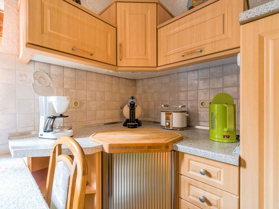 Apartment | Private kitchen | Stovetop, coffee/tea maker, highchair