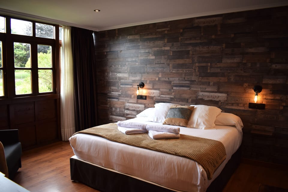 Superior Double Room | Minibar, in-room safe, desk, iron/ironing board