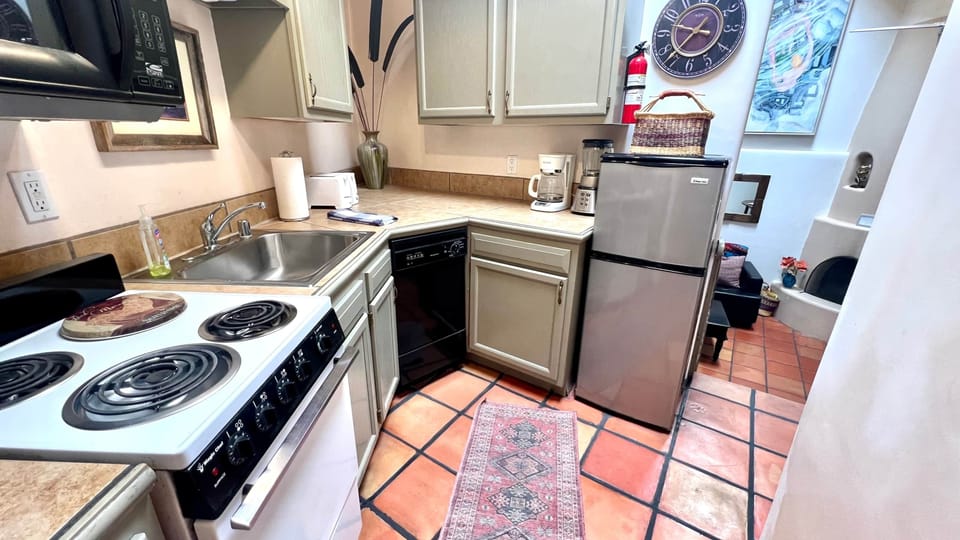 Kitchen leads into sunkin den 