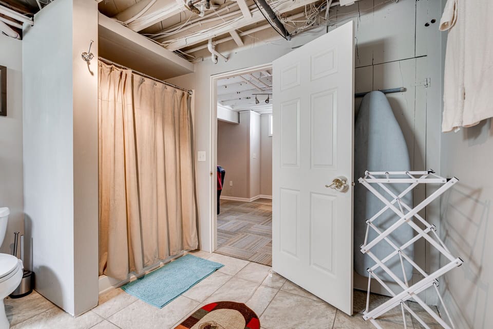 The basement lounge opens to a full bathroom.